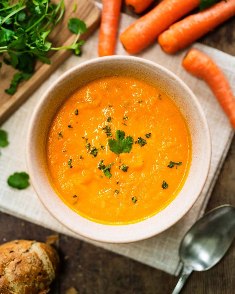 A bowl of Carrot and Coriander Soup with a sprinkle of coriander over the top. Image by Jaz Kitchen