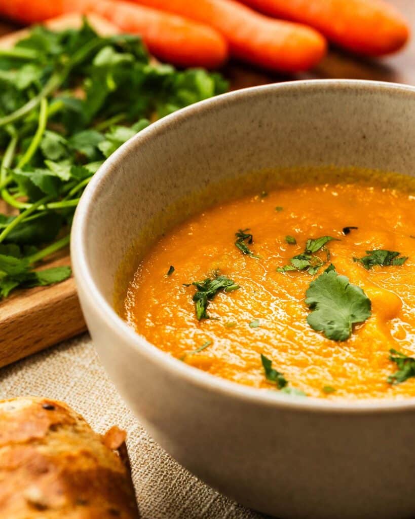 A bowl of Carrot and Coriander Soup with a sprinkle of coriander over the top. Image by Jaz Kitchen