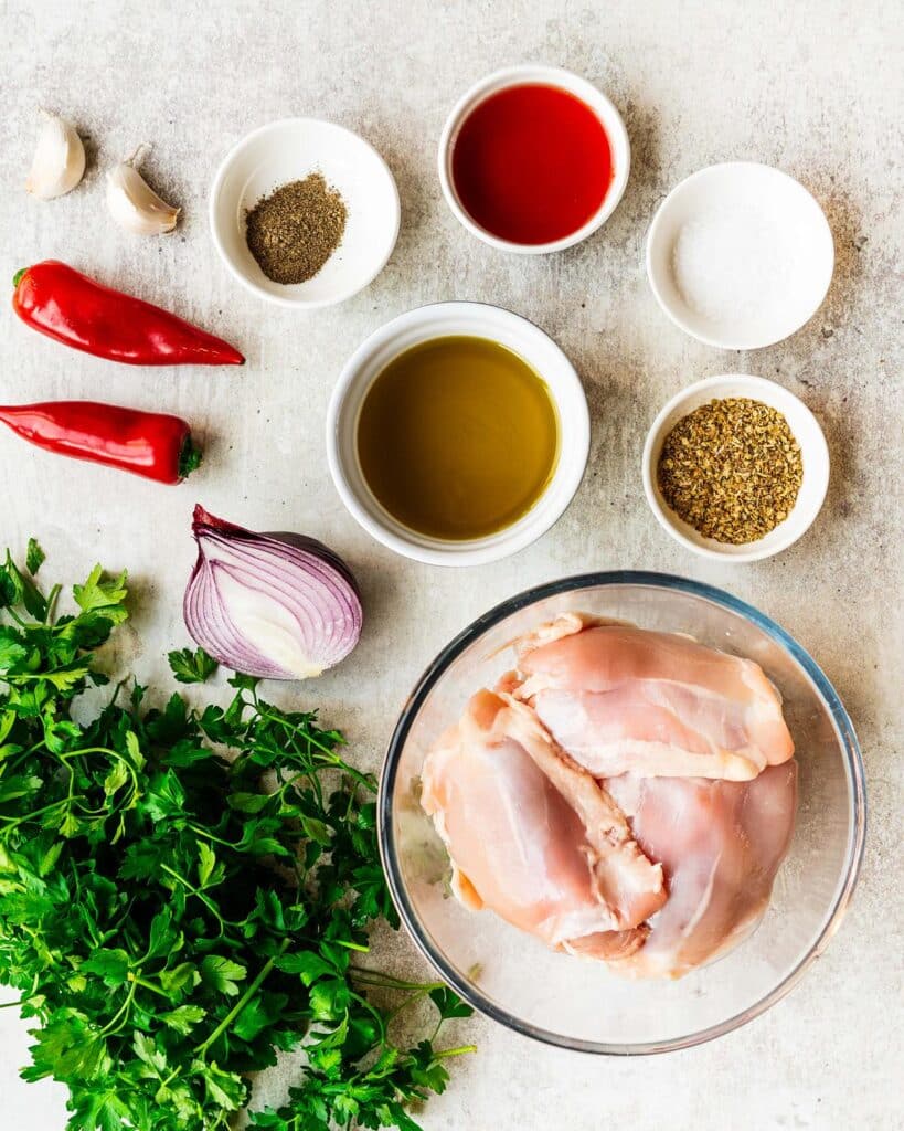 Ingredients required: parsley, chillies, red onion, garlic, oregano, salt, pepper, red wine vinegar, olive oil and chicken. Recipe by jaz kitchen