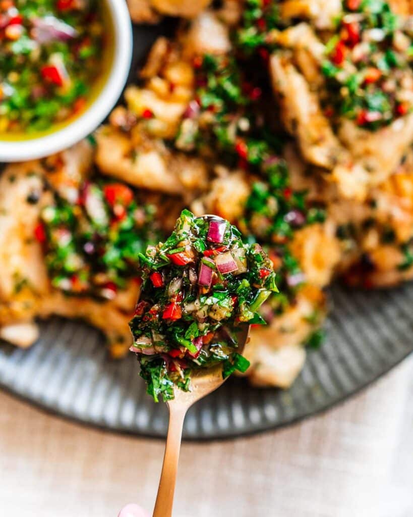 Our chimichurri with chicken is bright, vibrant and fresh, with tender chicken thighs and a beautiful sauce you will not be able to get enough of! Recipe by Jaz Kitchen