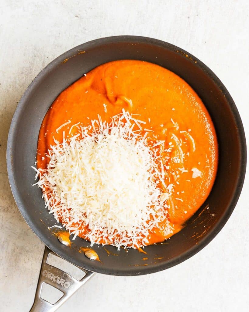 red pepper sauce in a pan with added cheese. Image by Jaz Kitchen