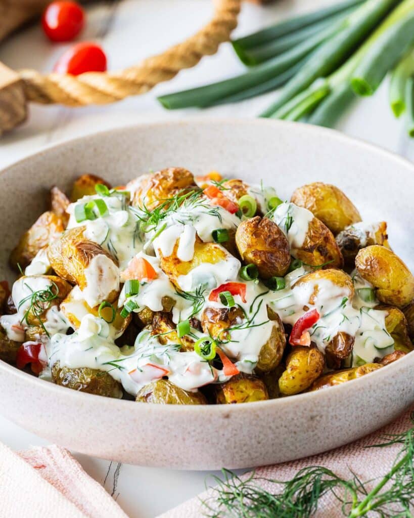 This crispy potato salad has it all: a light crunchy texture, cooling vibrant dressing and it looks so good to boot! Always a popular dish at any dinner table! Recipe by jaz kitchen