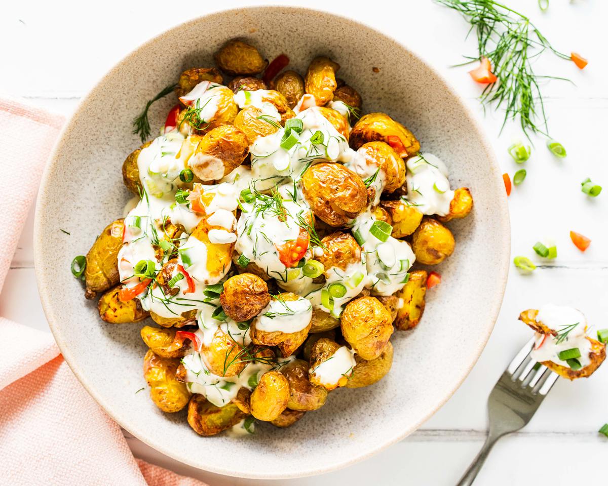 This crispy potato salad has it all: a light crunchy texture, cooling vibrant dressing and it looks so good to boot! Always a popular dish at any dinner table! Recipe by jaz kitchen