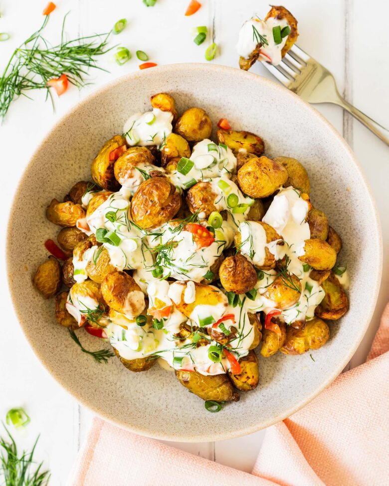 This crispy potato salad has it all: a light crunchy texture, cooling vibrant dressing and it looks so good to boot! Always a popular dish at any dinner table! Recipe by jaz kitchen