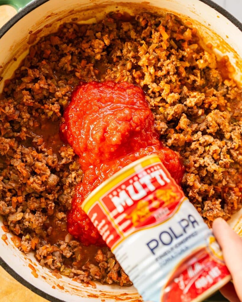 add a good quality tin of chopped tomatoes. Image by Jaz Kitchen