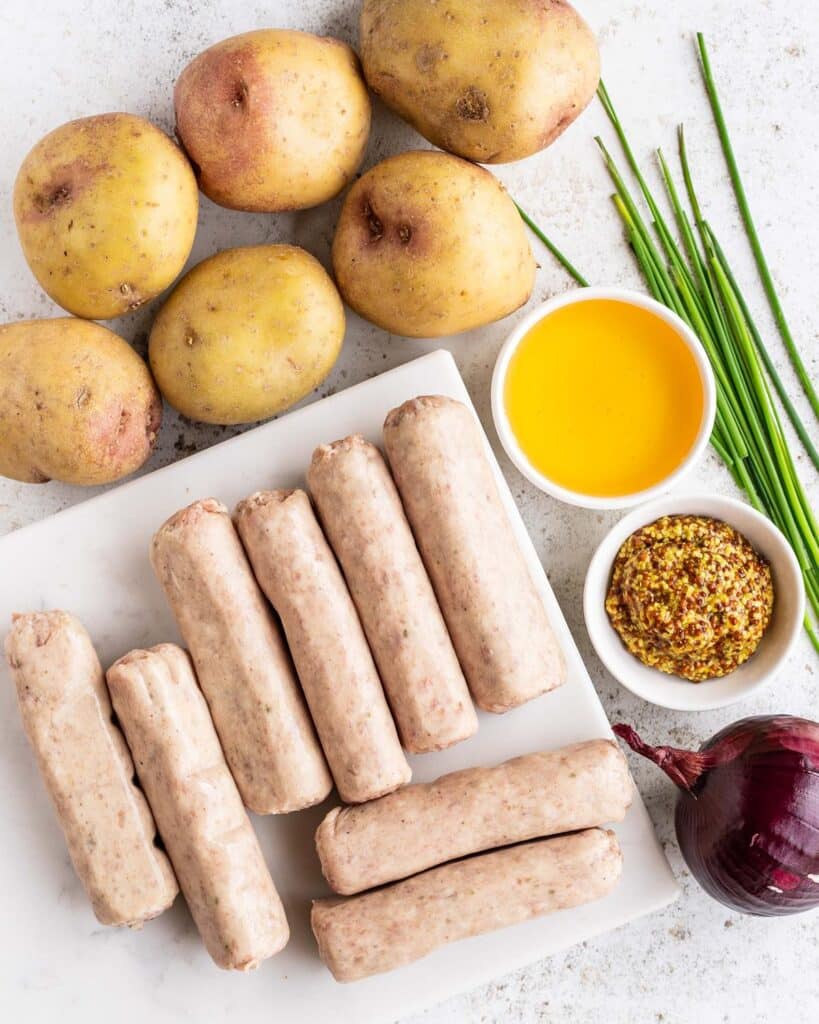 Ingredients required: potatoes, red onion, oil, sausages, honey, mustard, chives, sesame seeds, salt & pepper. Recipe be jaz kitchen
