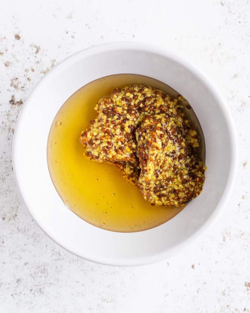 Mix the honey and mustard together before adding to the cooked sausages to glaze, coat and caramelise. Recipe by jaz kitchen