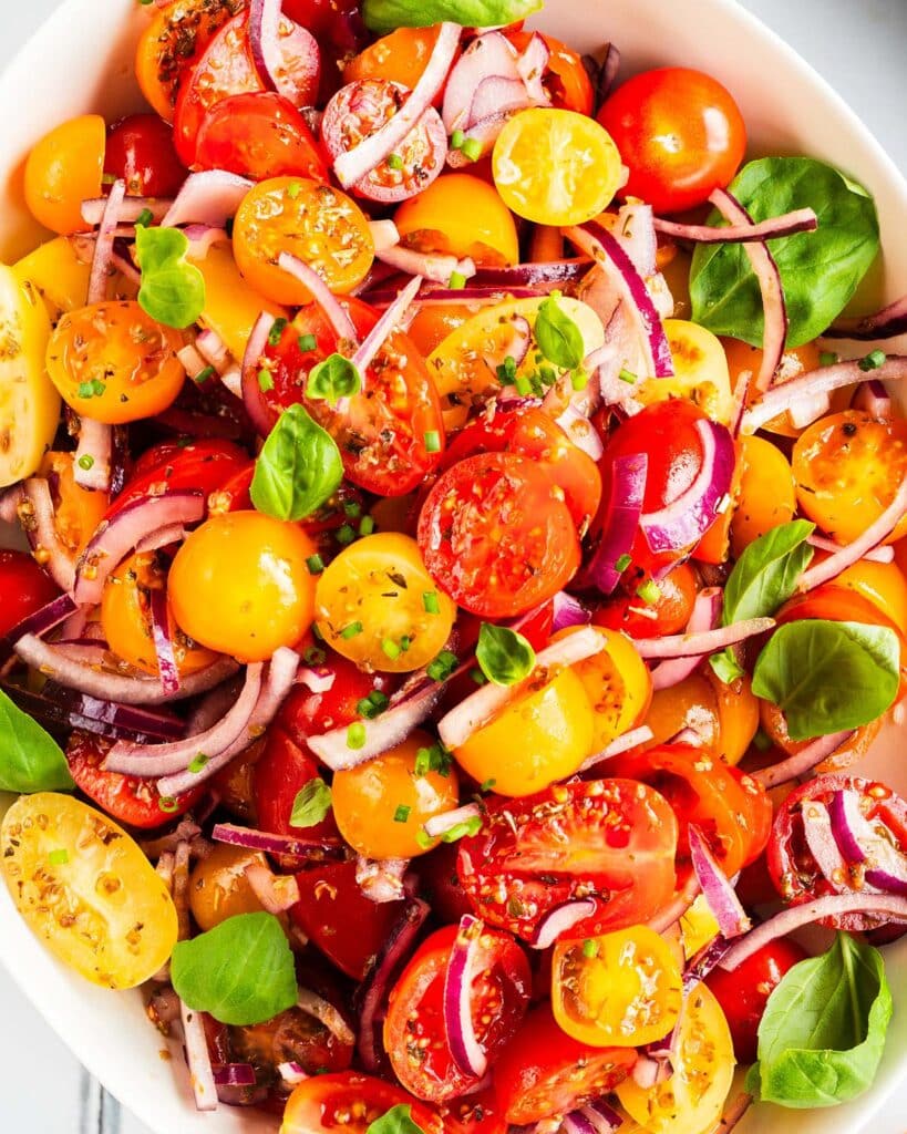 Tomato onion salad is a delicious tangy side dish. Serve as a starter with some fresh bread or as an accompaniment to a vibrant spiced curry. Recipe by jaz kitchen