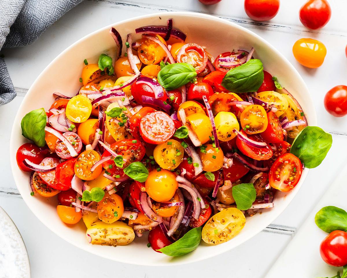Tomato onion salad is a delicious tangy side dish. Serve as a starter with some fresh bread or as an accompaniment to a vibrant spiced curry. Recipe by Jaz Kitchen