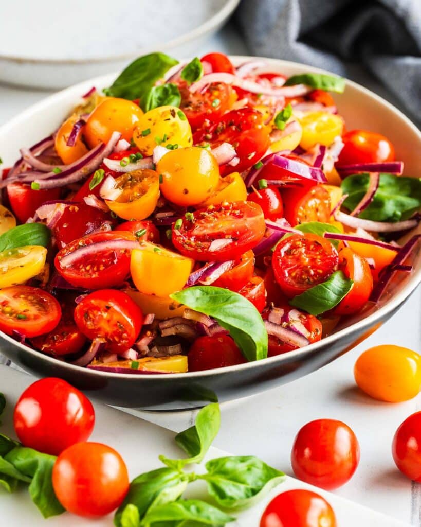 Tomato onion salad is a delicious tangy side dish. Serve as a starter with some fresh bread or as an accompaniment to a vibrant spiced curry. Recipe by jaz kitchen