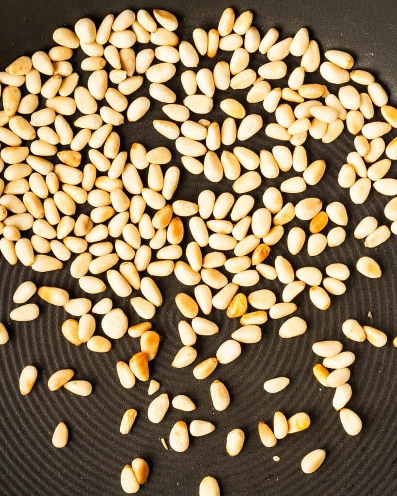 lightly toasted pine nuts for pesto sauce. Image by Jaz Kitchen