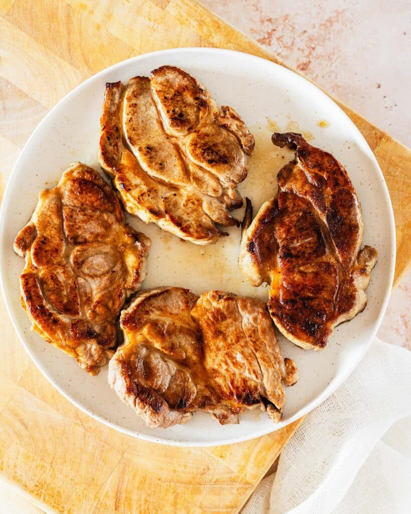 four cooked pork steaks. Image by Jaz Kitchen