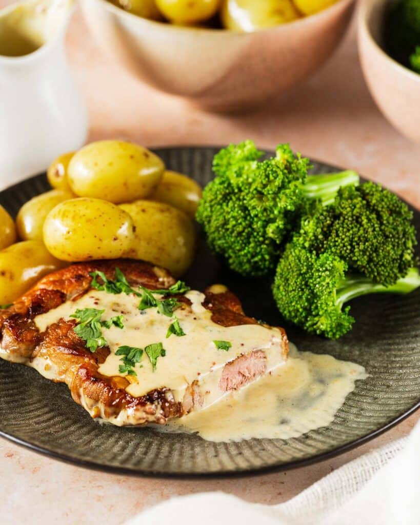Creamy honey mustard pork steaks - served with potatoes and broccoli.  Image by Jaz Kitchen